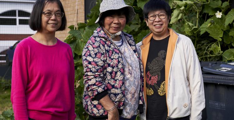 Three women standing together