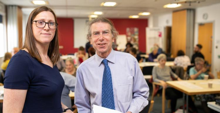 man and woman at meeting