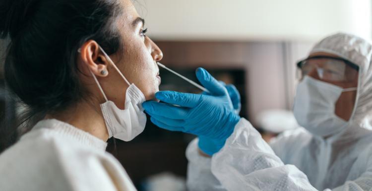 Woman having a COVID PCR test Woman having a COVID PCR test