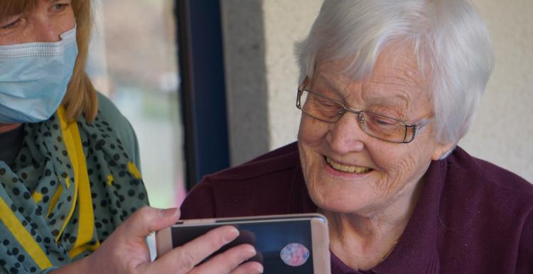 An elderly woman in a care home 