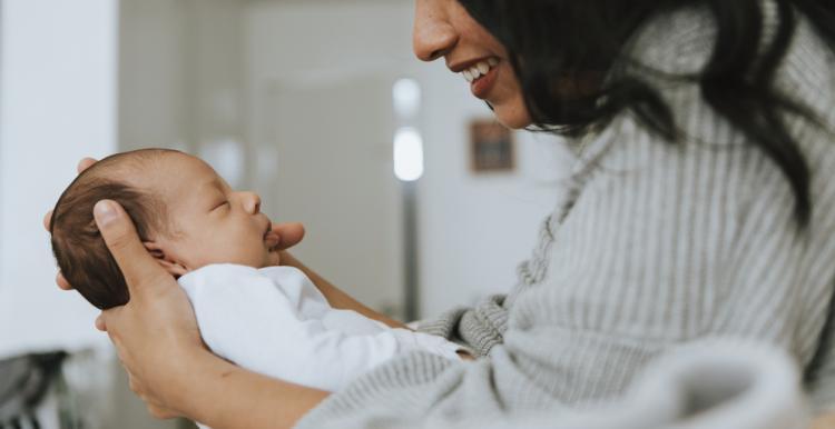 mother holding her baby mother holding her baby