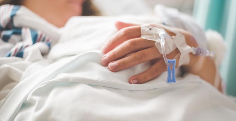 A patient in a hospital bed 