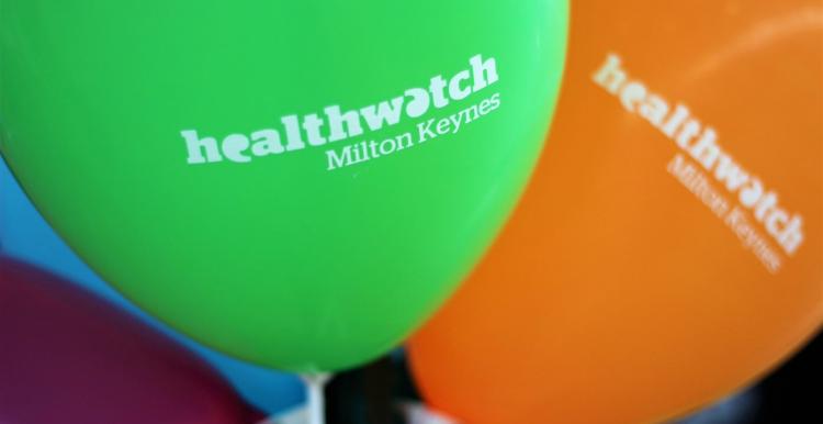 Green and orange Healthwatch MK balloons 