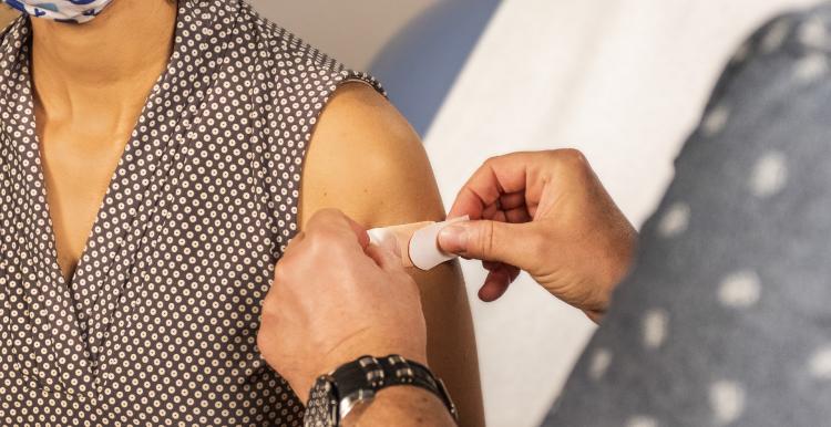 A women has a vaccination A women has a vaccination