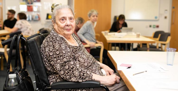 An elderly lady in a wheelchair