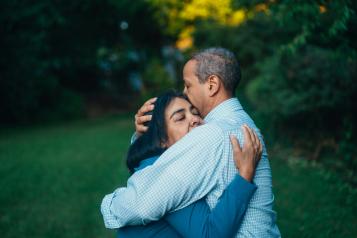 A man and a woman hugging 