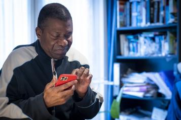 A man looking at a mobile phone