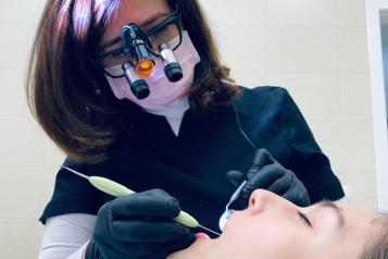 A dentist treating a patient 