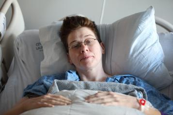 Woman in a hospital bed 