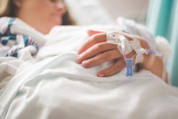 A patient in a hospital bed 