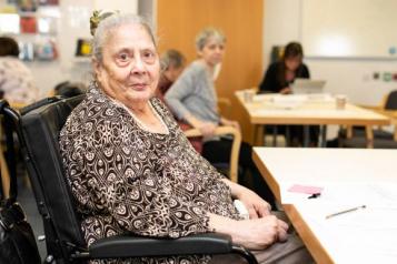 An elderly lady in a wheelchair 