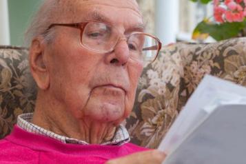 elderly man reading 