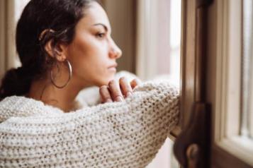 woman looking out of window