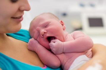 Woman holding a newborn 