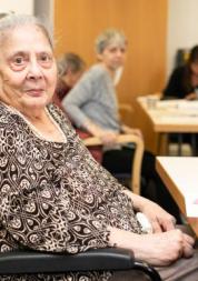 An elderly lady in a wheelchair 